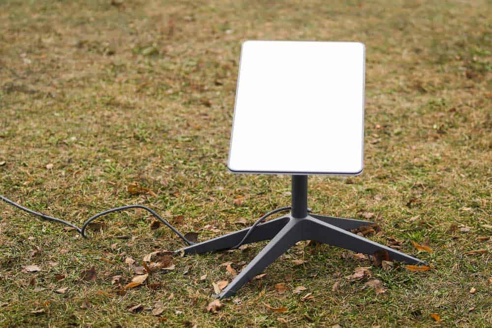 An antenna for receiving internet signals from space Starlink on the ground in the park