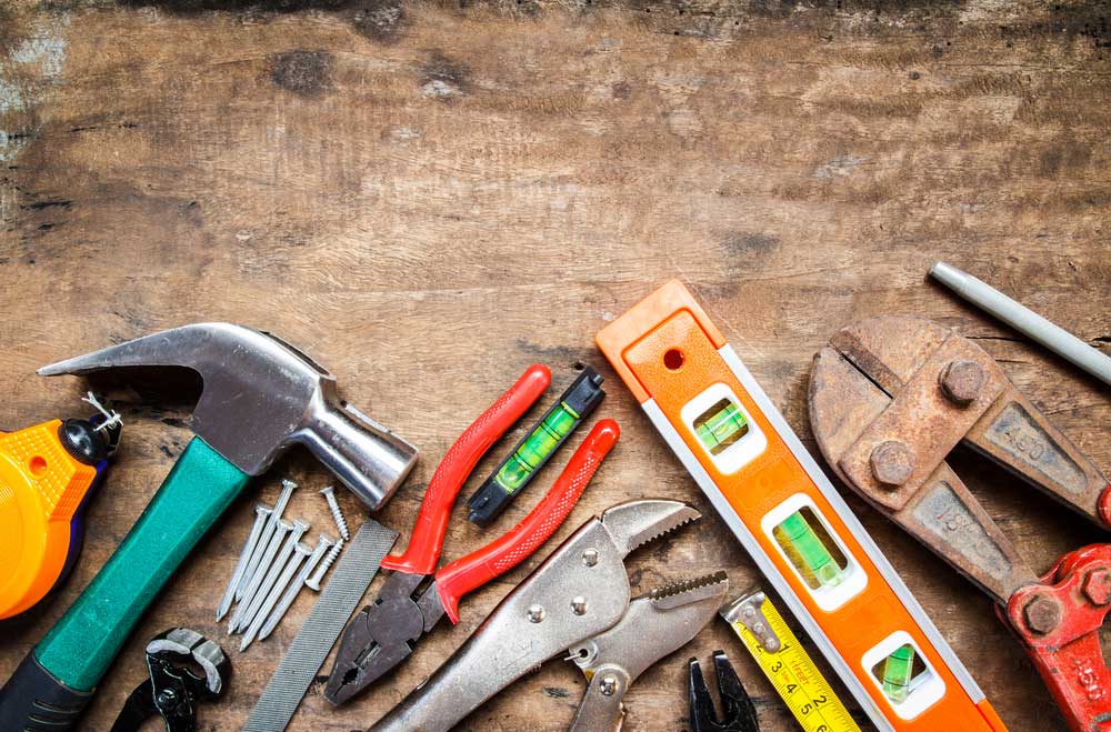 Tool kit on wood background