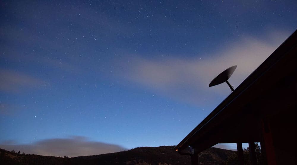 For a better signal, mount the Starlink satellite dish on the roof of your home where the sky is clear