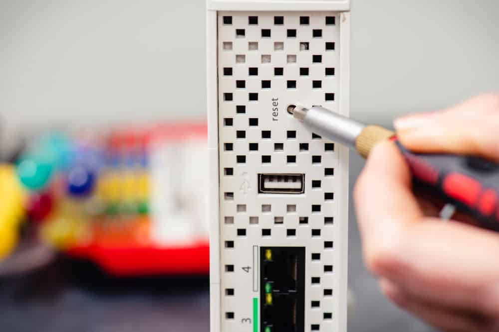 A router reset using a screwdriver