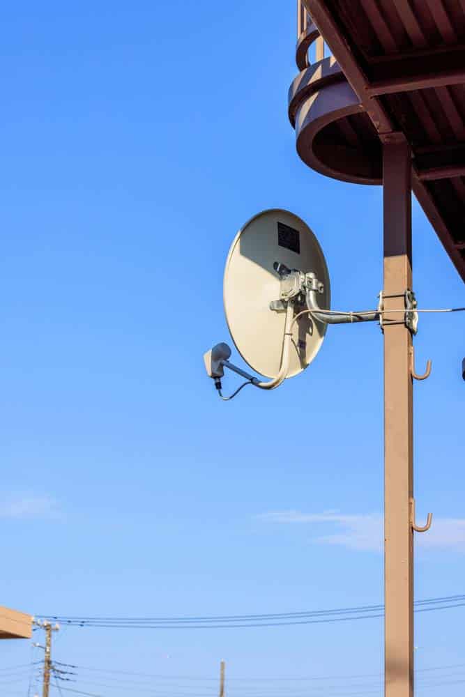 A satellite dish on a pole
